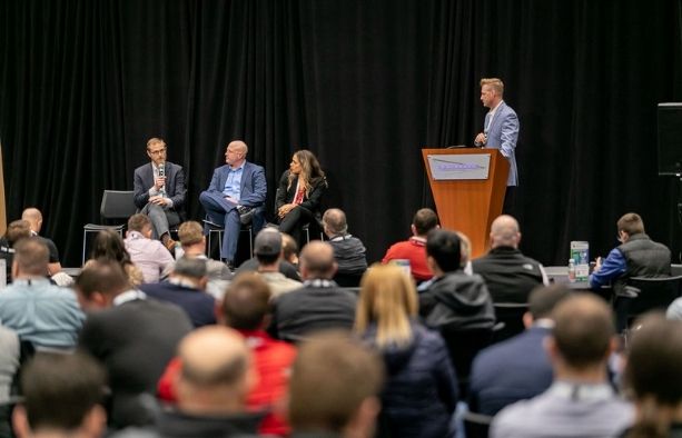 Construction procurement and supply chain leaders at an industry conference panel